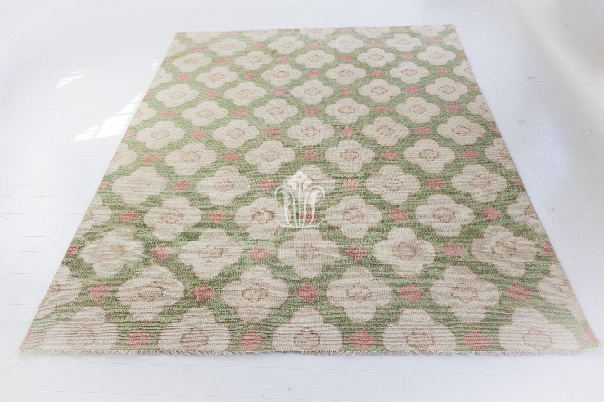 Floral patterned paper with a logo on a white background