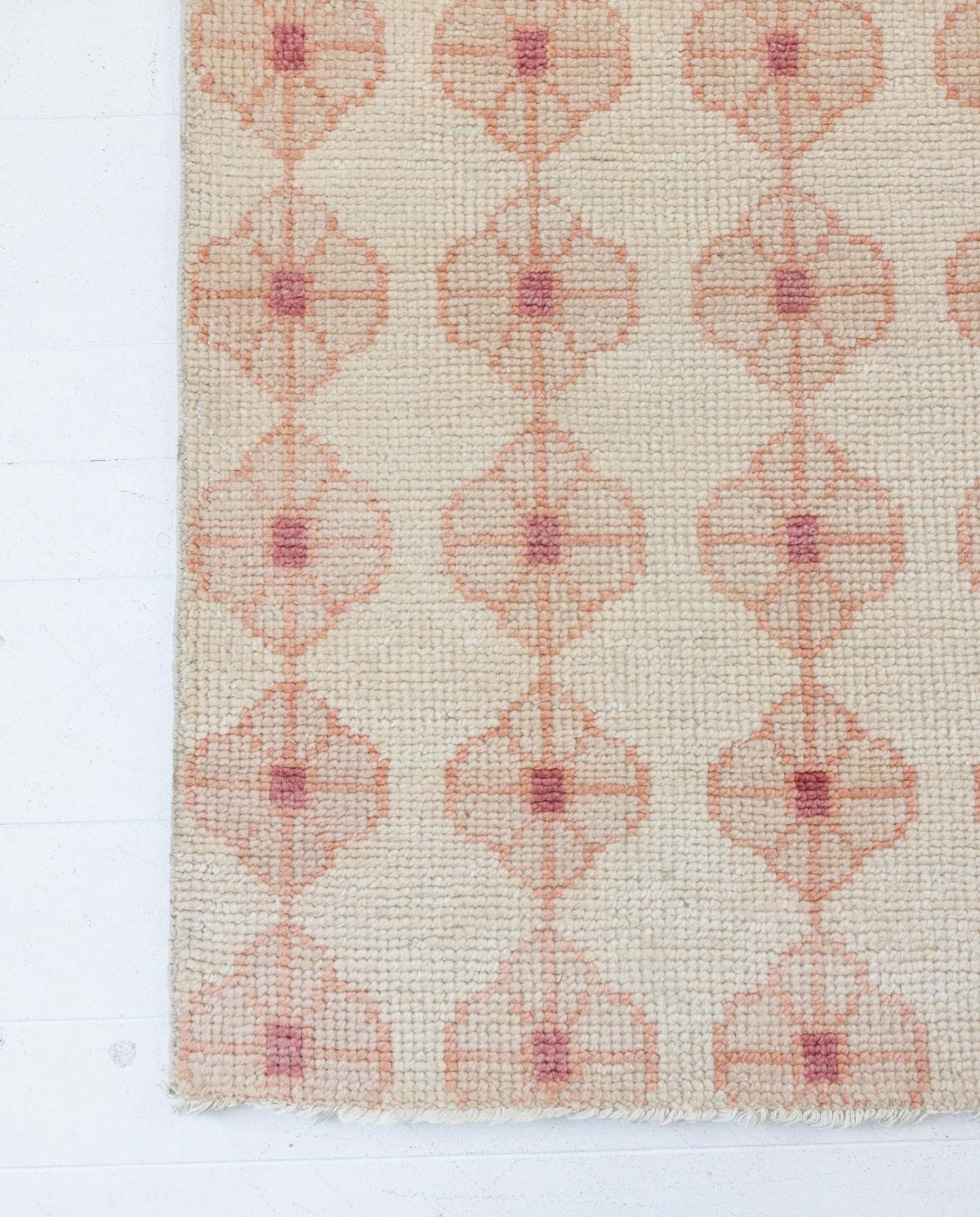 Patterned handknotted rug with floral motif