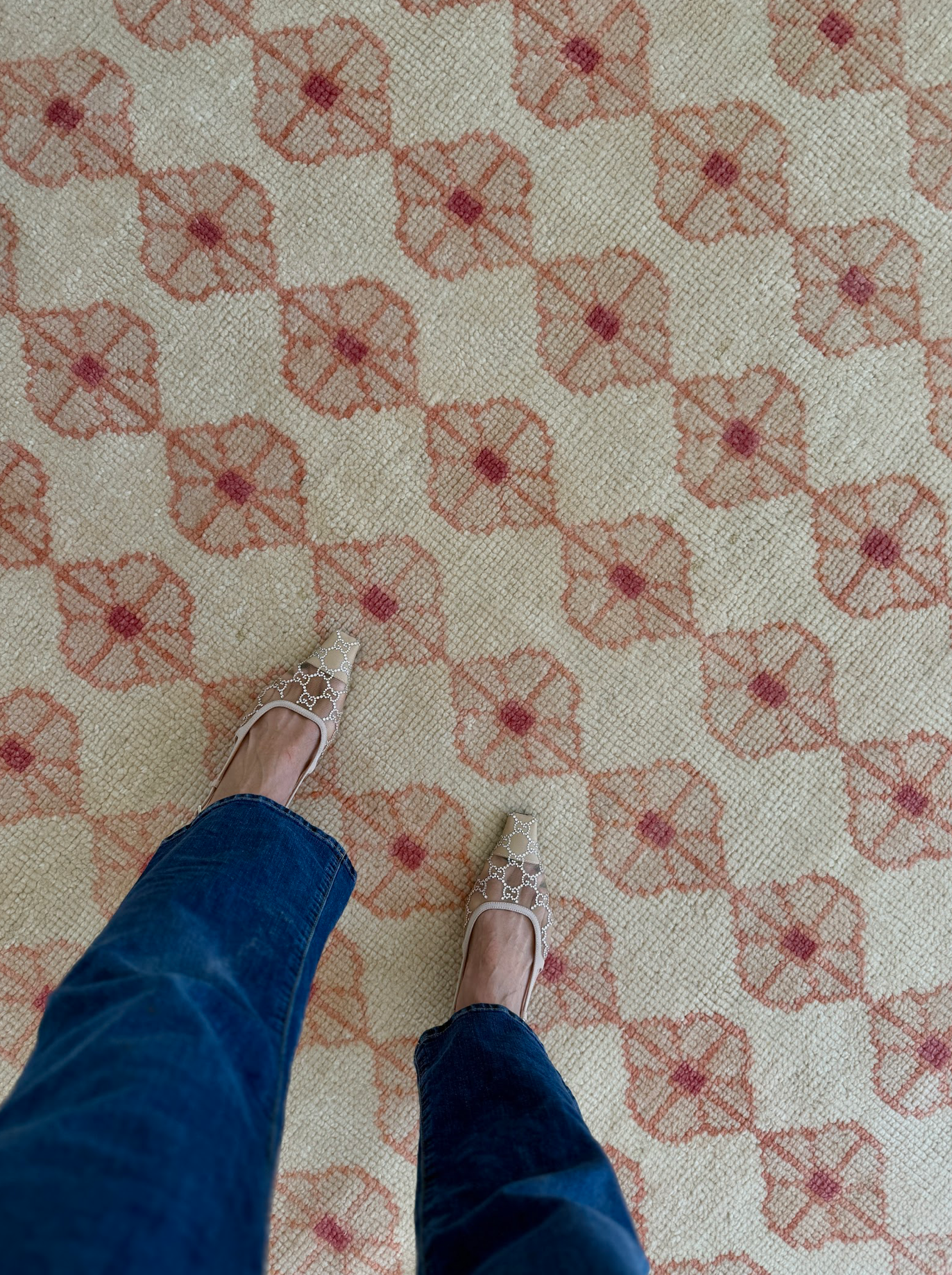 Patterned handknotted rug with floral motif