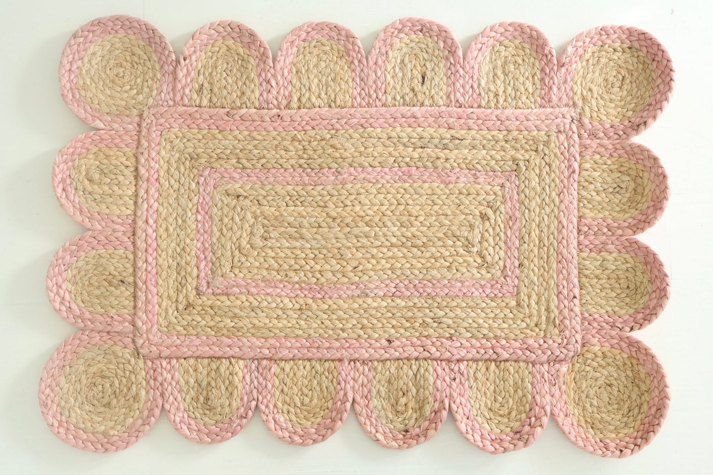 Hand-braided natural jute rug with scalloped light pink border and rectangular woven center – Light Pink Scalloped Jute Rug by Locust Lane Rugs