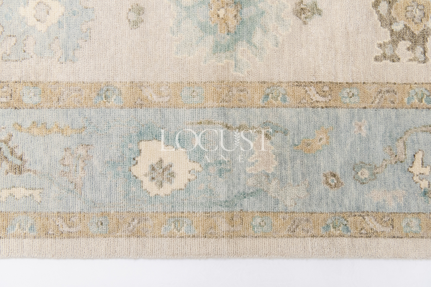 neutral and blue handknotted rug