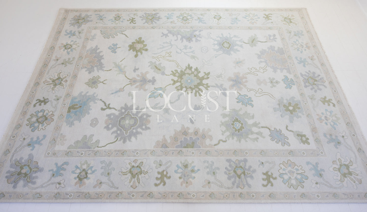 cream with blue and greens hand knotted rug