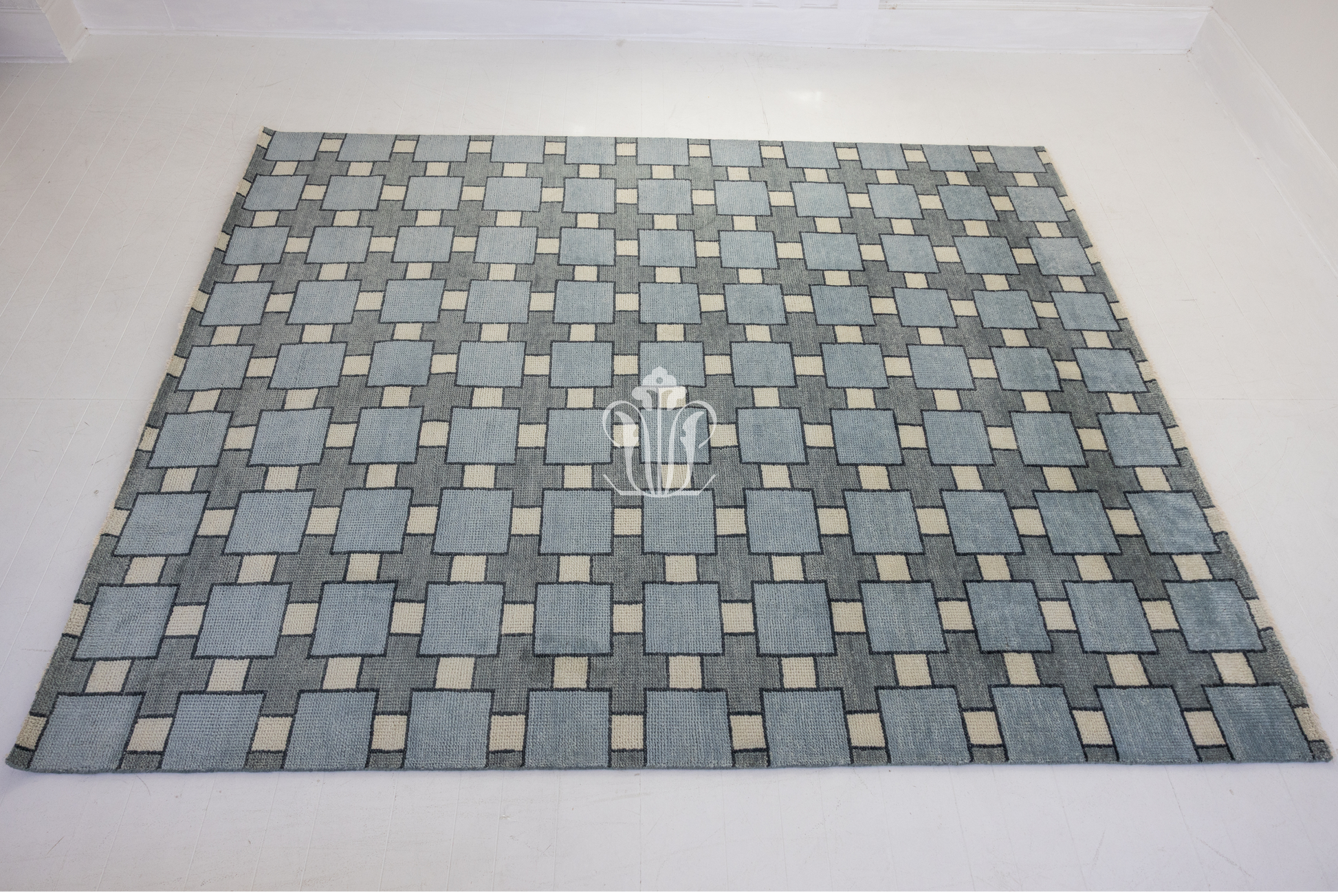 Patterned rug with geometric design on a white background