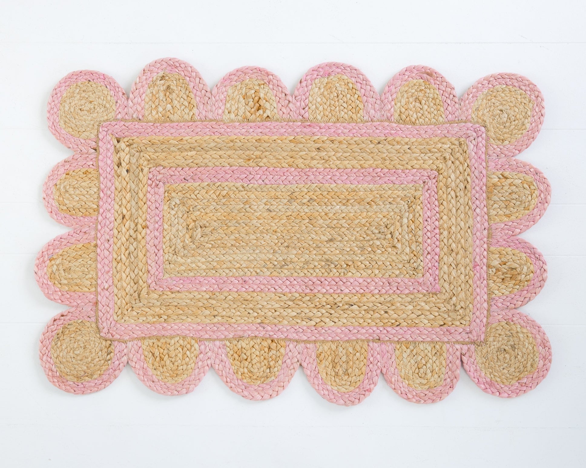 Hand-braided natural jute rug with bright pink scalloped border and rectangular center – Bright Pink Scalloped Jute Mini Rug by Locust Lane Rugs