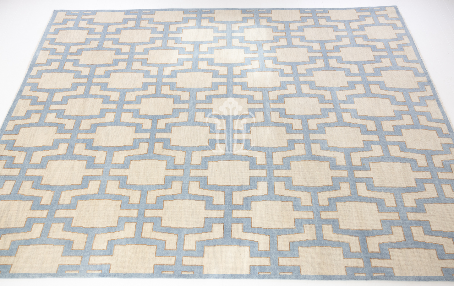 Della hand-knotted wool rug featuring a geometric Oushak pattern