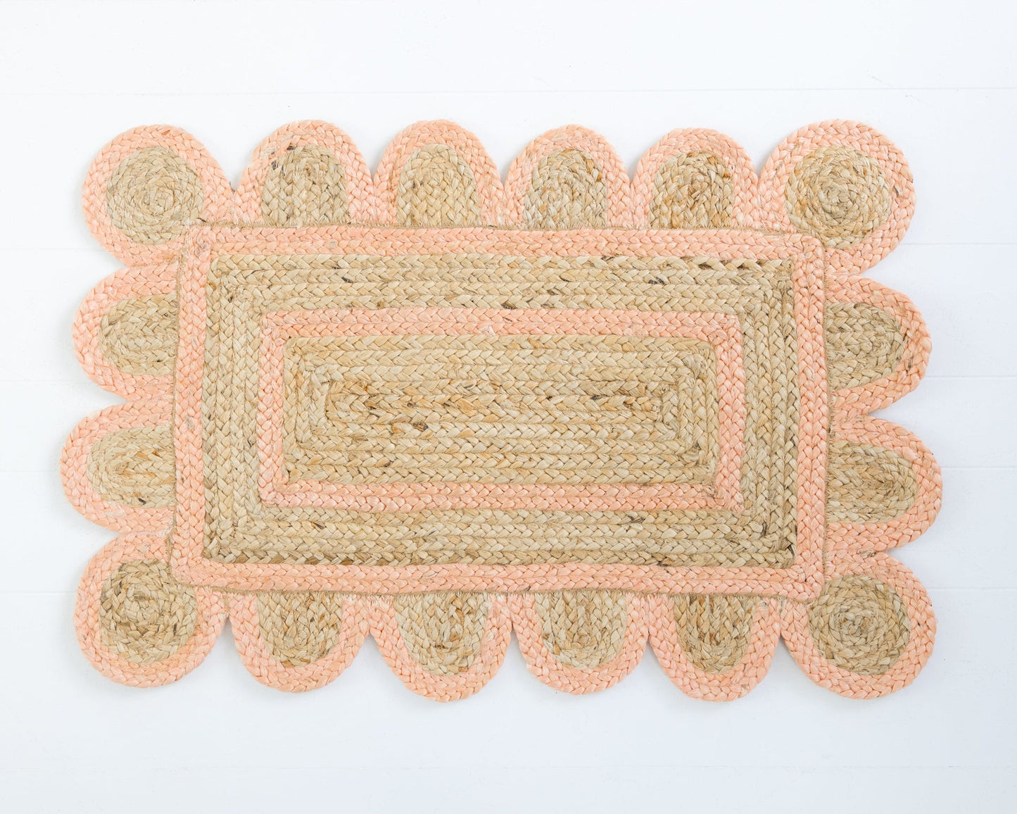 Hand-braided natural jute rug with scalloped border in soft peach – Peach Scalloped Jute Mini Rug by Locust Lane Rugs