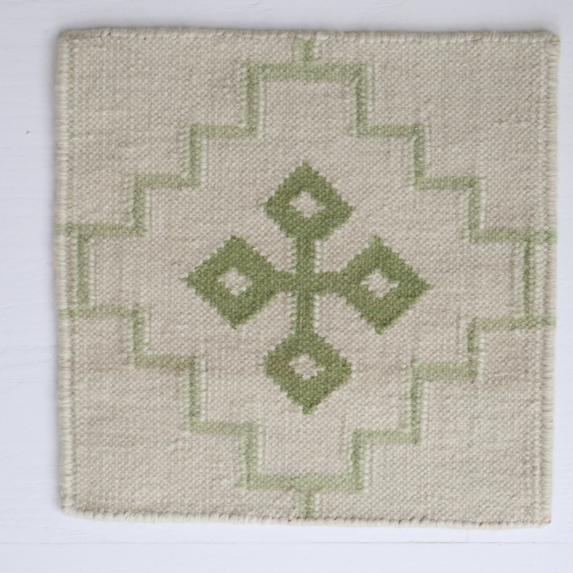 Handwoven wool rug sample in pistachio green and cream geometric cross pattern – Pistachio Green Flatweave Sample by Locust Lane Rugs