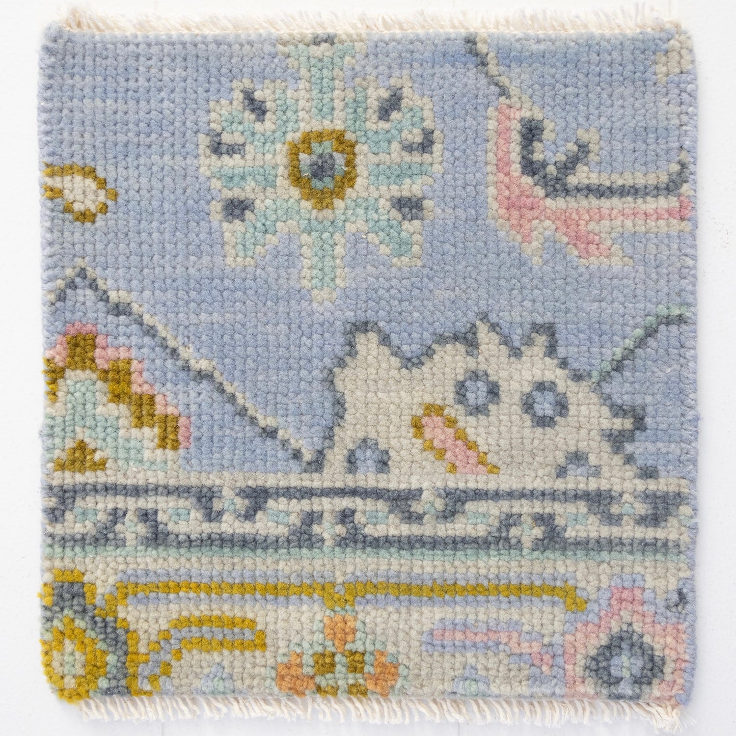 Handknotted wool rug sample in sky blue, blush, ivory, and ochre with traditional Oushak pattern – Odette Rug Sample by Locust Lane Rugs