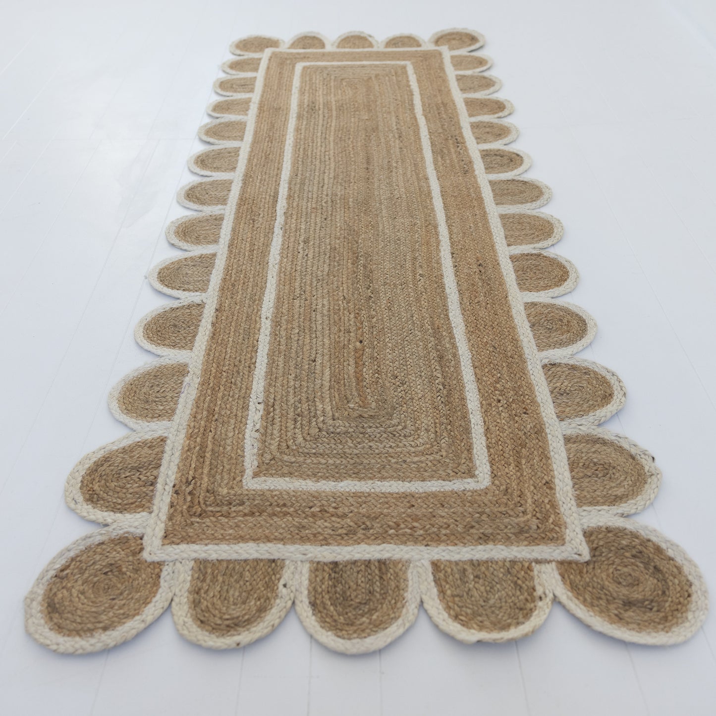 Handwoven 100% jute rug with natural texture, white scalloped edge, and protective cotton backing – White Scalloped Edge Jute Rug by Locust Lane Rugs