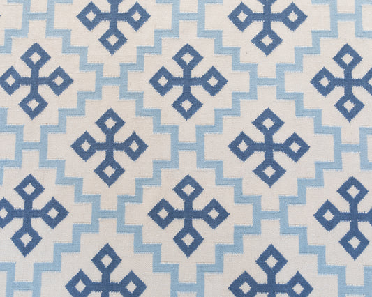 Denim Cross Flatweave Dhurrie Rug with blue geometric cross pattern on ivory wool