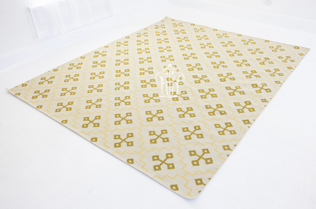 Handwoven butter yellow and ivory geometric flatweave wool area rug