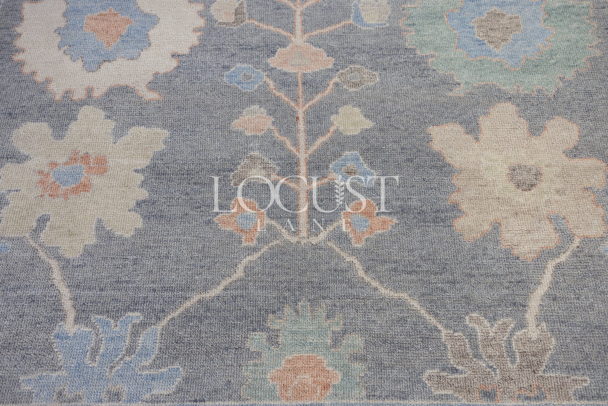 muted with earthy tones hand knotted rug