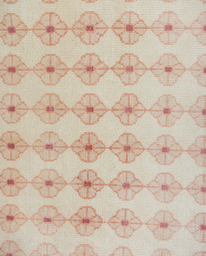 Patterned rug with geometric design on a beige background