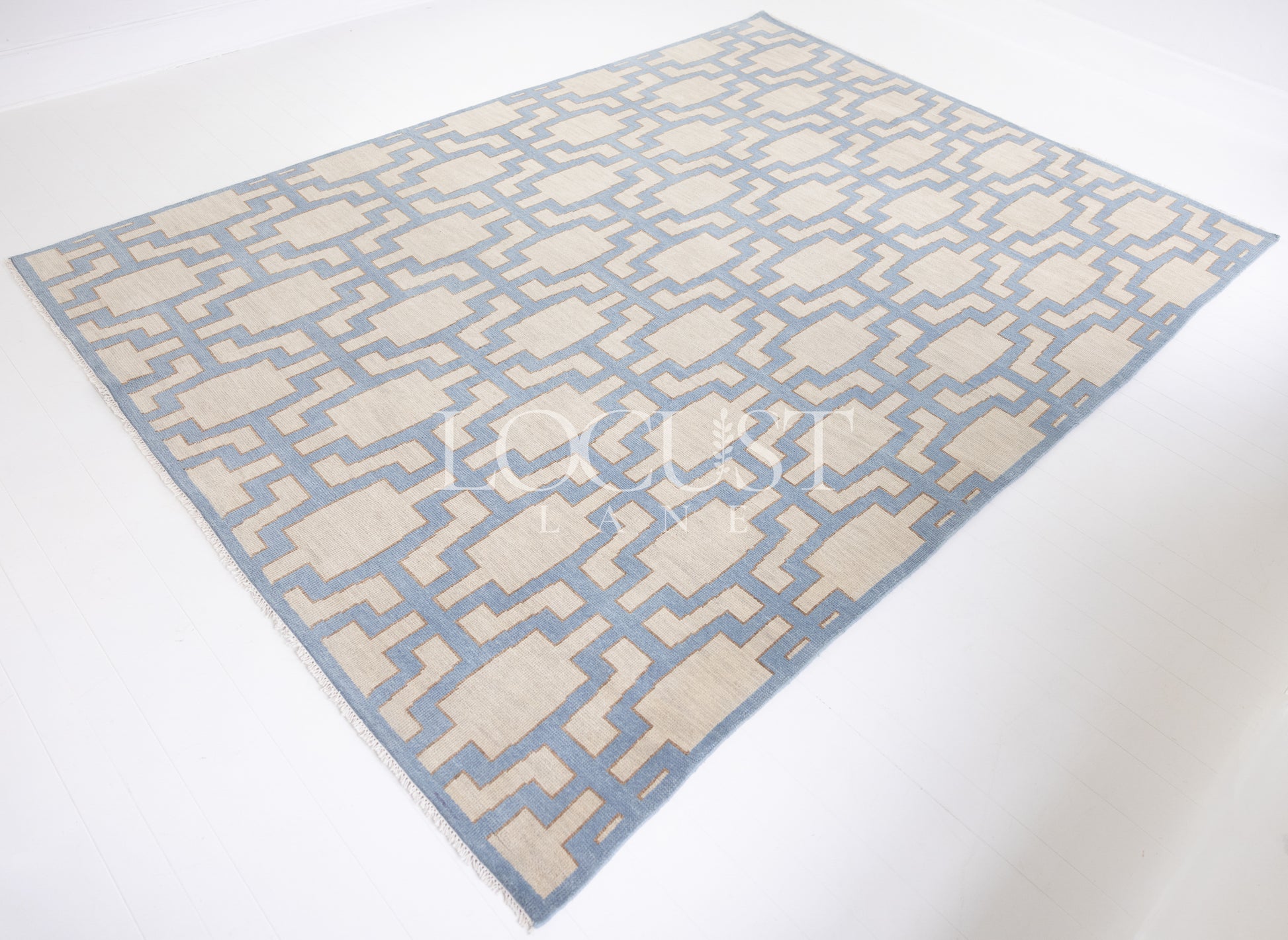 Della hand-knotted wool rug in blue, ivory, and chartreuse from Locust Lane Rugs.