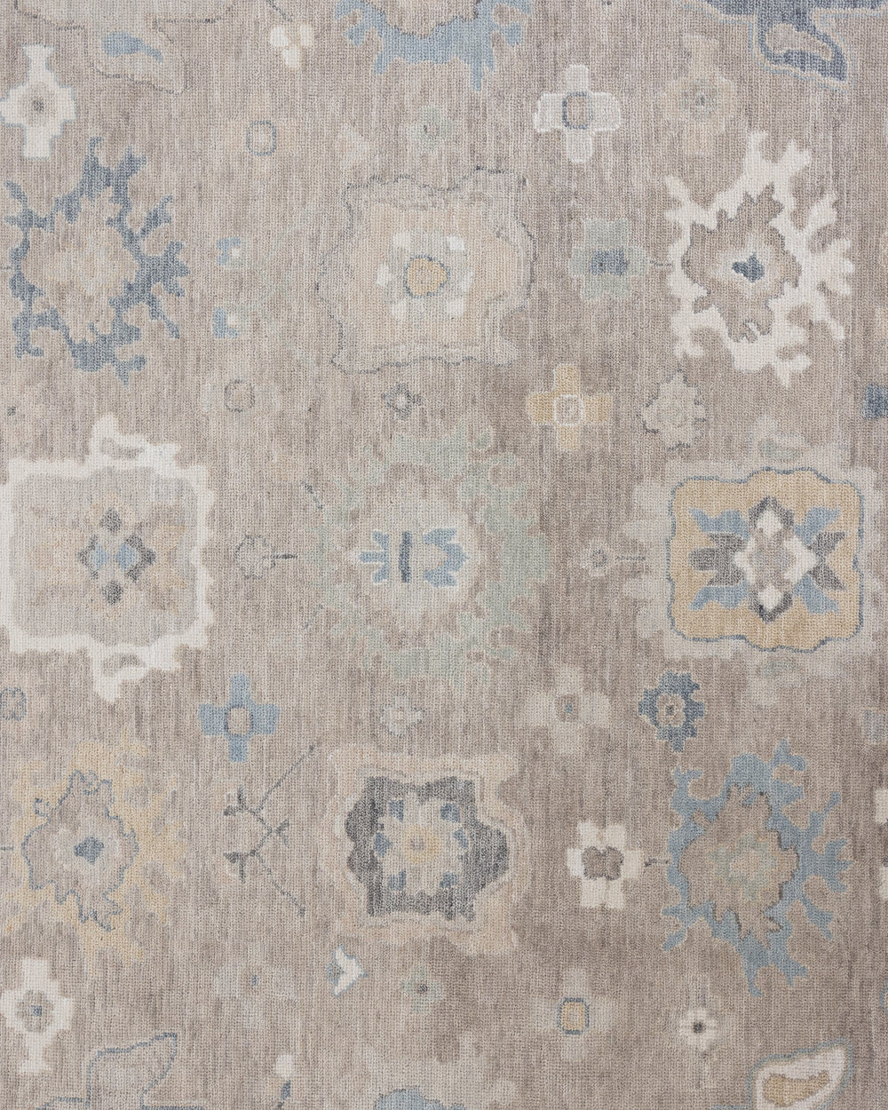 Etta hand-knotted wool Modern Oushak rug in soft neutral and muted blue tones