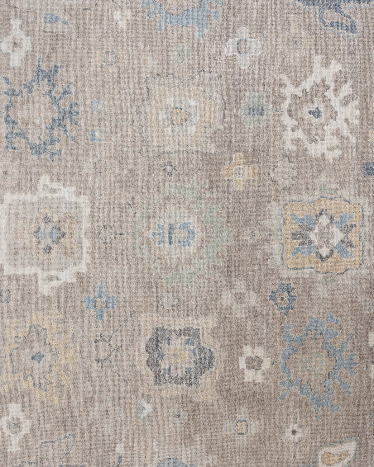 Etta hand-knotted wool Modern Oushak rug in soft neutral and muted blue tones