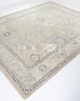 soft tones of beige, blue and grey hand knotted rug