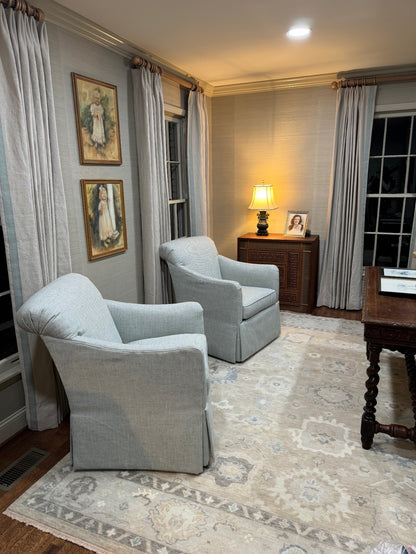 Etta neutral and blue Oushak rug styled in an elegant living room