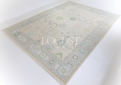 Fiona hand-knotted wool Oushak rug in ivory and faded blue from Locust Lane Rugs.