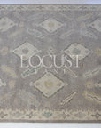 purplish grey hand knotted rug with pastel 