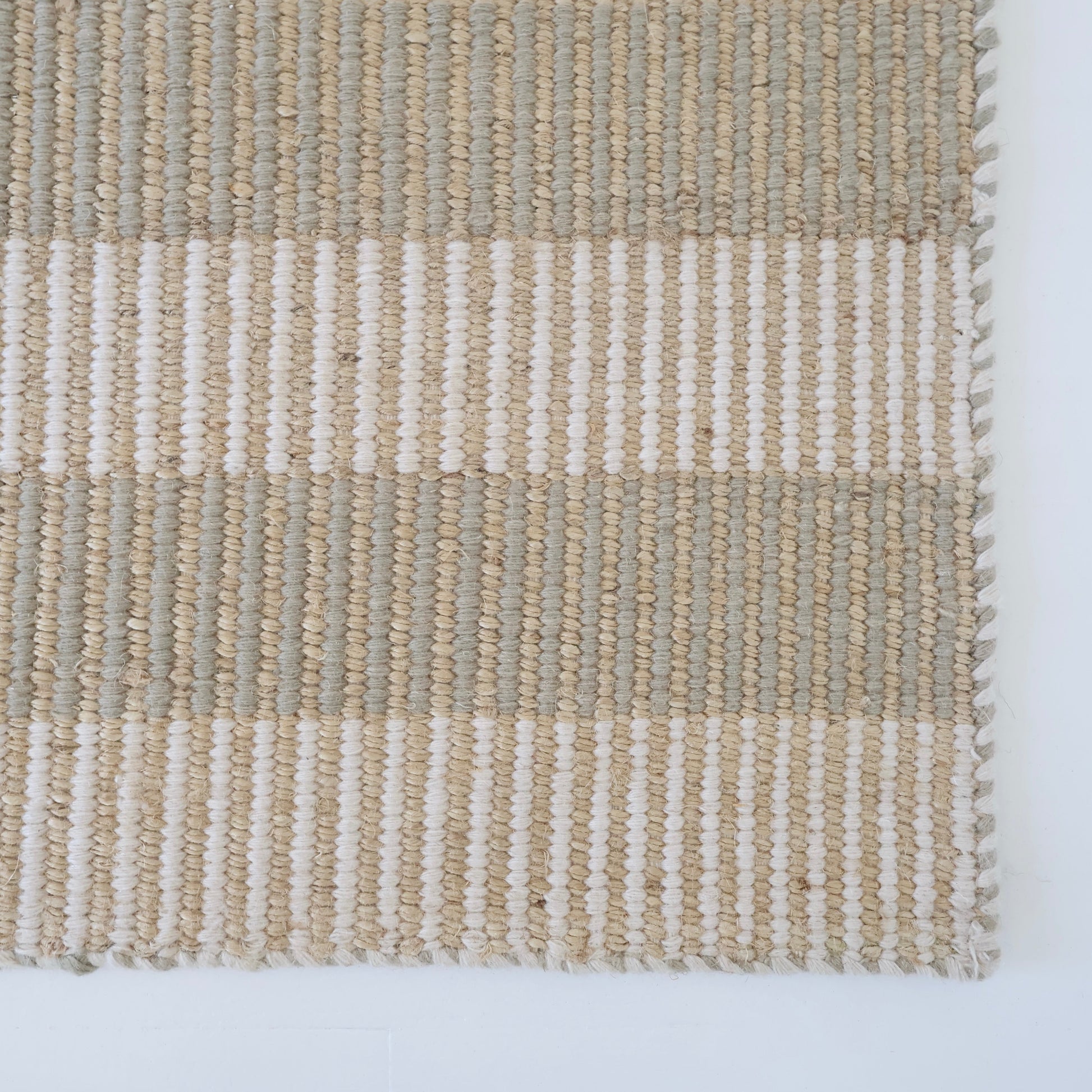 Neutral taupe and ivory striped handwoven rug made from a durable jute and wool blend — Broken Stripe Neutral Rug by Locust Lane Rugs