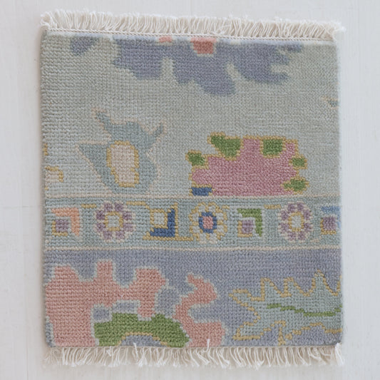 Handknotted wool rug sample in pastel blue, blush, and sage geometric floral pattern – June Rug Sample by Locust Lane Rugs