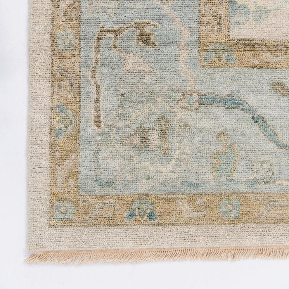 neutral and blue handknotted rug