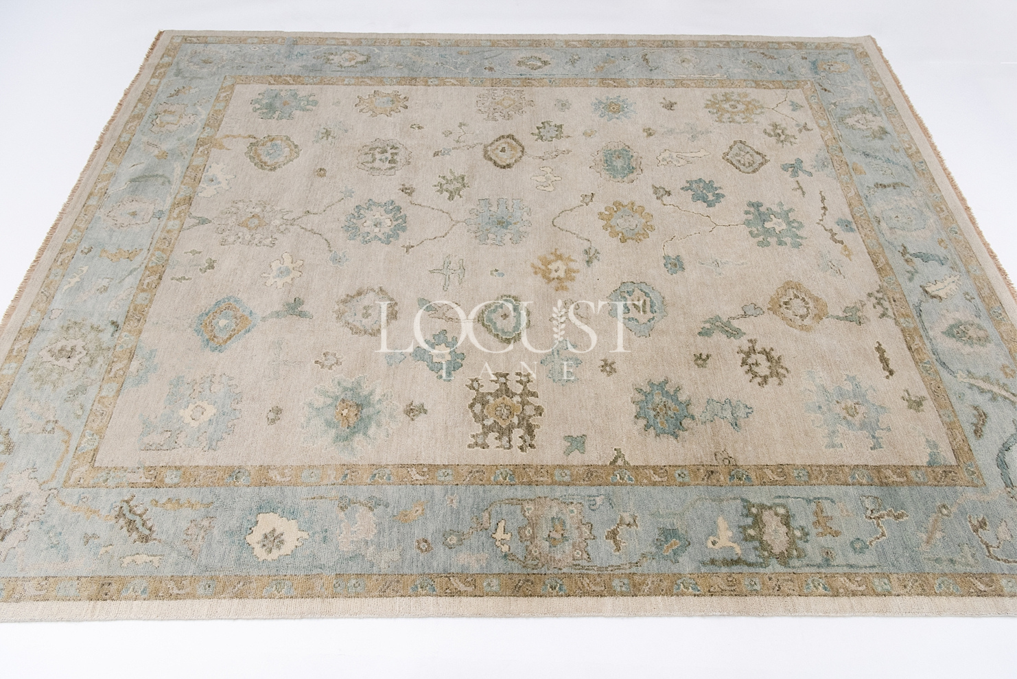 neutral and blue handknotted rug