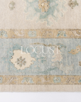 neutral and blue handknotted rug