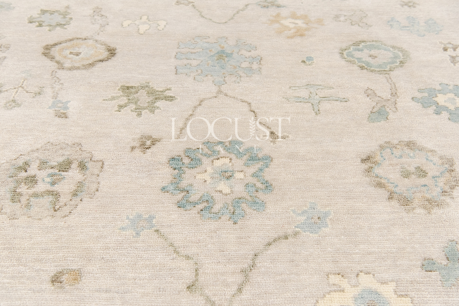 neutral and blue handknotted rug