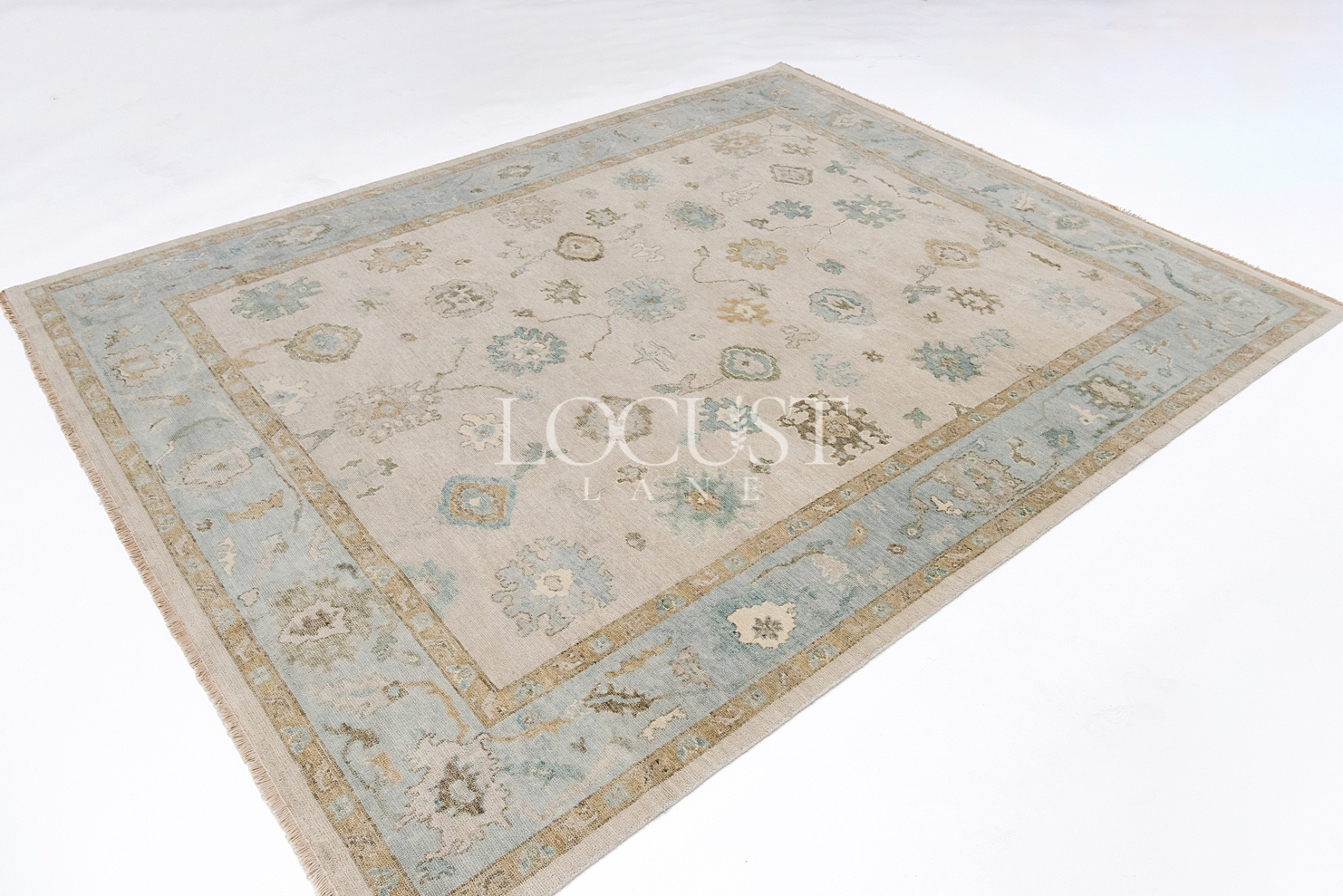 neutral and blue handknotted rug