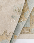 neutral and blue handknotted rug