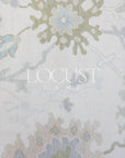 cream with blue and greens hand knotted rug