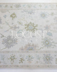 cream with blue and greens hand knotted rug