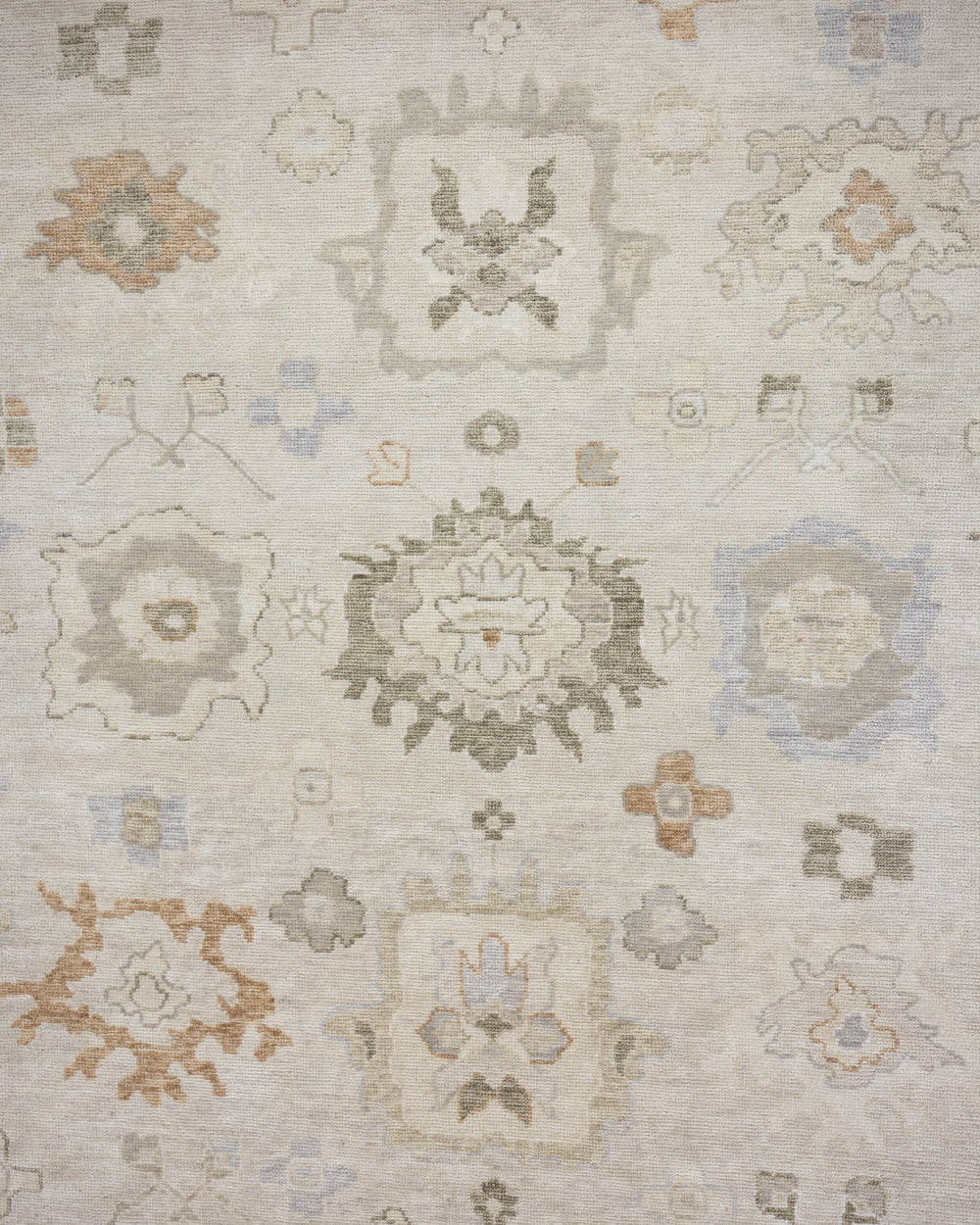 Patsy hand-knotted wool Oushak rug featuring warm ivory, sage green, and muted gold floral motifs