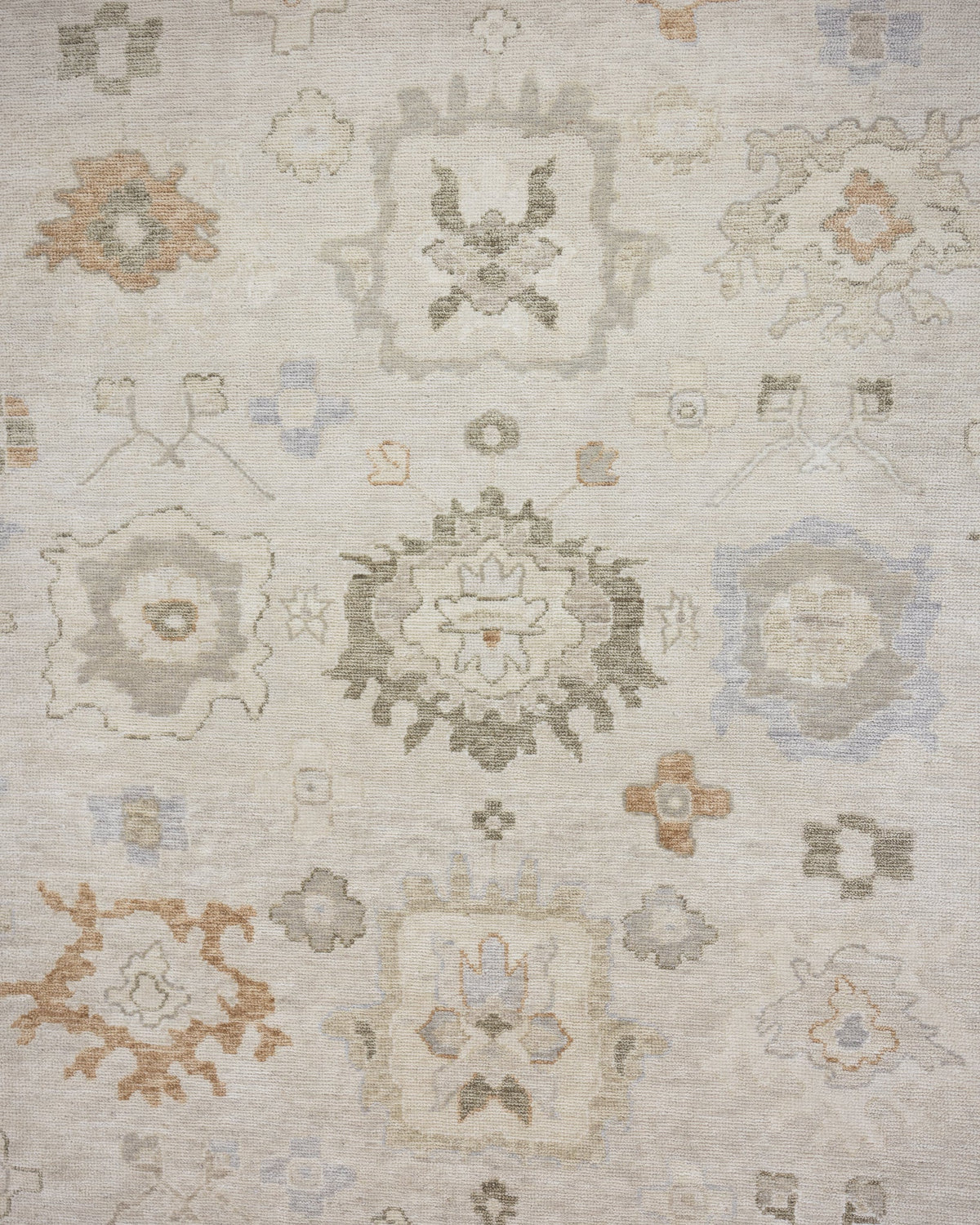Patsy hand-knotted wool Oushak rug featuring warm ivory, sage green, and muted gold floral motifs
