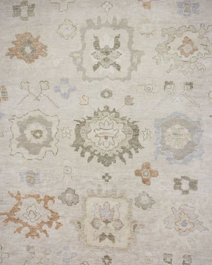 Patsy hand-knotted wool Oushak rug featuring warm ivory, sage green, and muted gold floral motifs