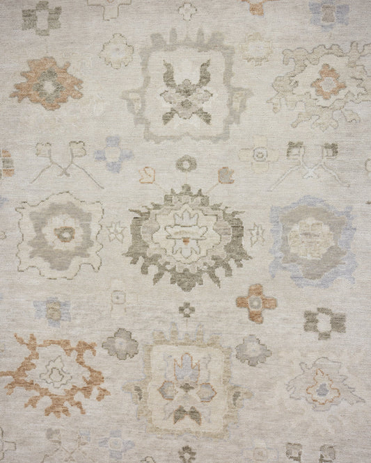 Patsy hand-knotted wool Oushak rug featuring warm ivory, sage green, and muted gold floral motifs