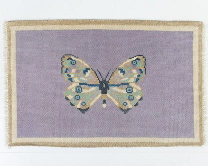 Hand-knotted wool rug featuring a butterfly motif on a lavender background with ivory and taupe border – Purple Butterfly Mini Rug by Locust Lane Rugs