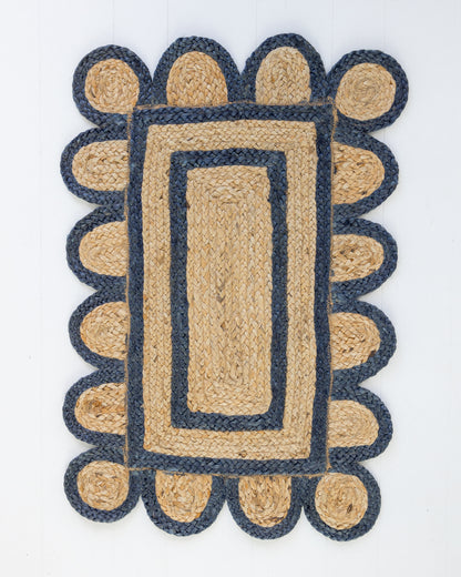 Handwoven 100% jute rug with natural field, navy scalloped edge, and protective cotton backing – Navy Scalloped Edge Jute Rug by Locust Lane Rugs