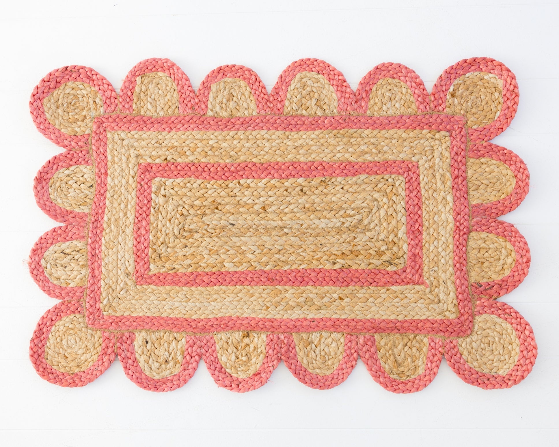 Handwoven 100% jute rug with natural field, poppy-red scalloped edge, and protective cotton backing – Poppy Scalloped Edge Jute Rug by Locust Lane Rugs