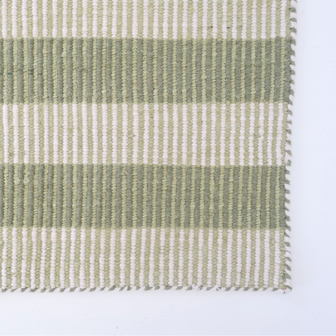 Green and ivory striped handwoven rug made from a durable jute and wool blend — Broken Stripe Green Rug by Locust Lane Rugs