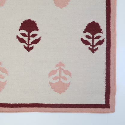 Flatweave rug with maroon and pink floral motifs and coordinating border, reversible construction — Cottage Floral Rug by Locust Lane Rugs