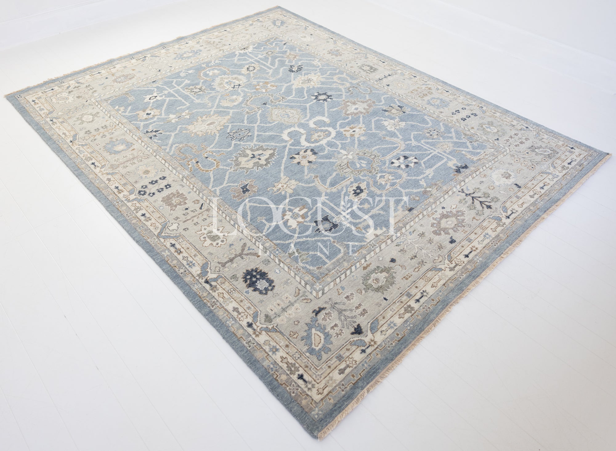 soft blue and neutral tone hand knotted rug