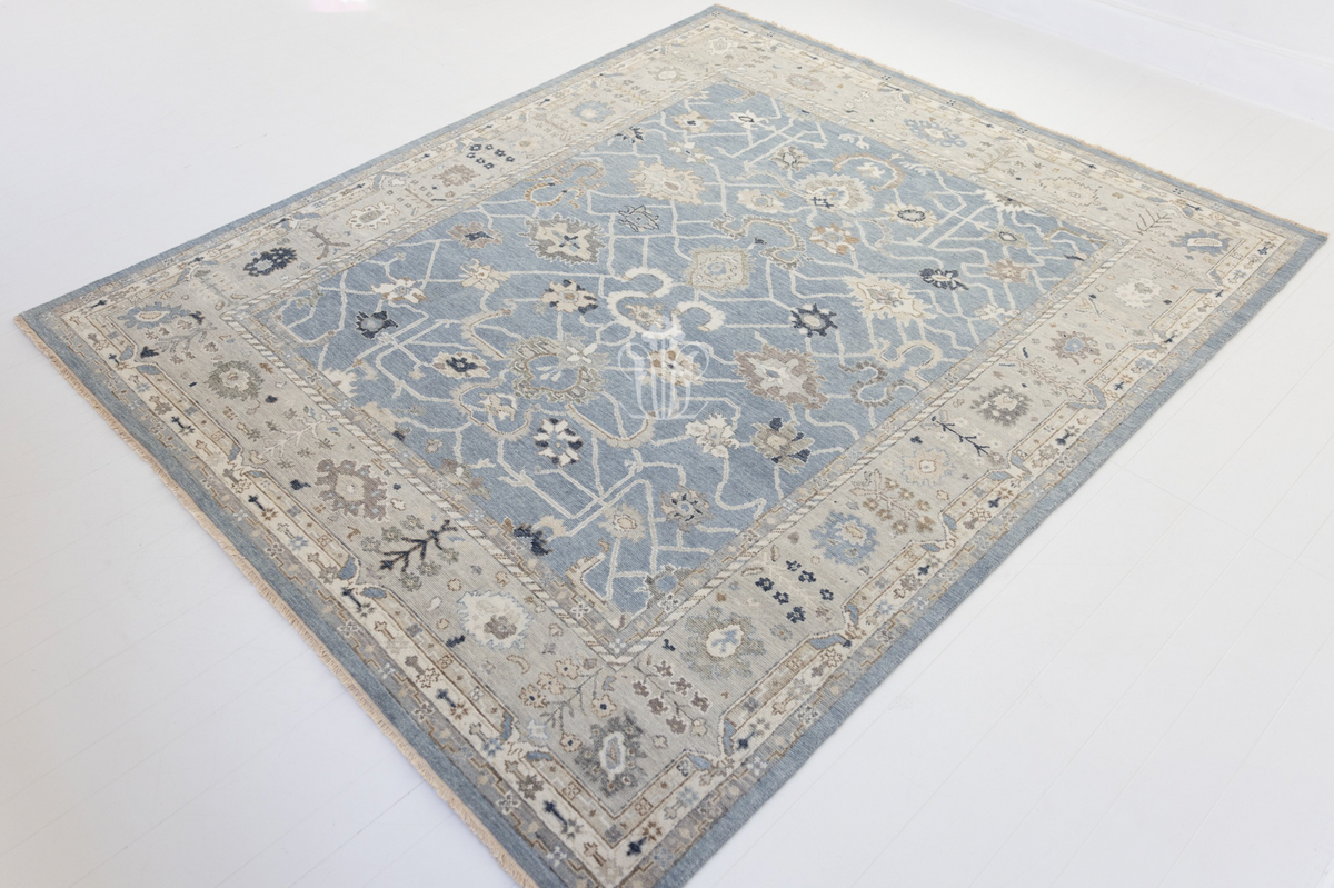 Trudie Modern Oushak area rug featuring a rich blue background and traditional Persian-inspired pattern