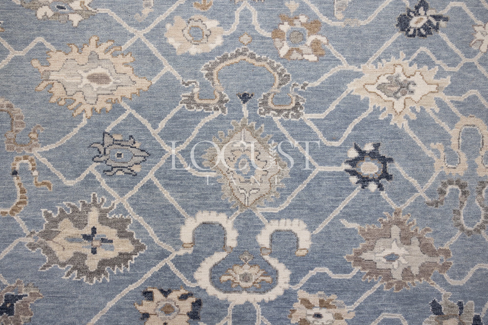 soft blue and neutral tone hand knotted rug