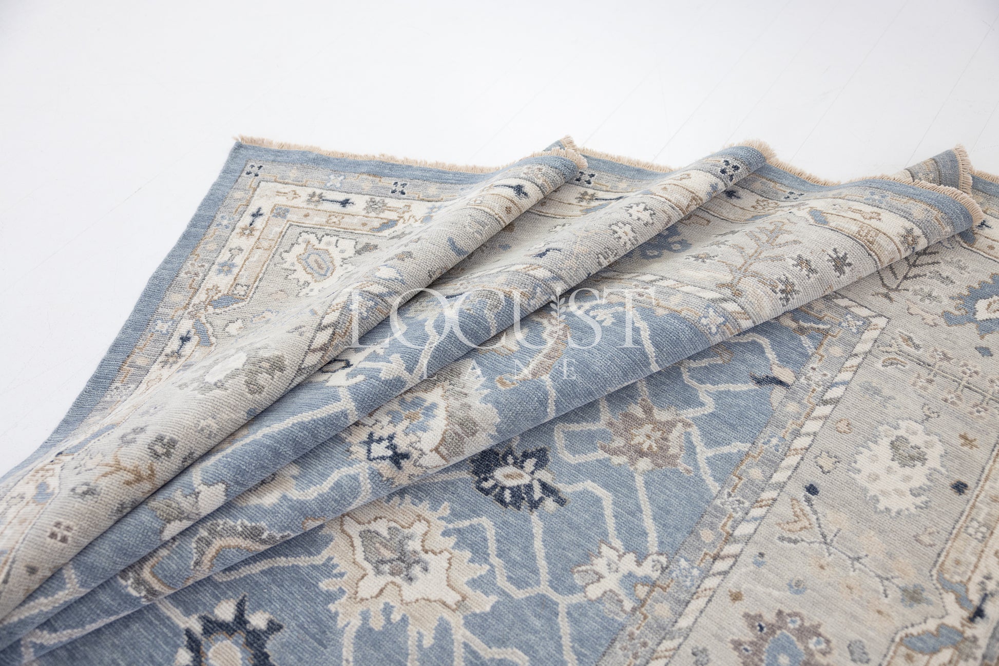 soft blue and neutral tone hand knotted rug