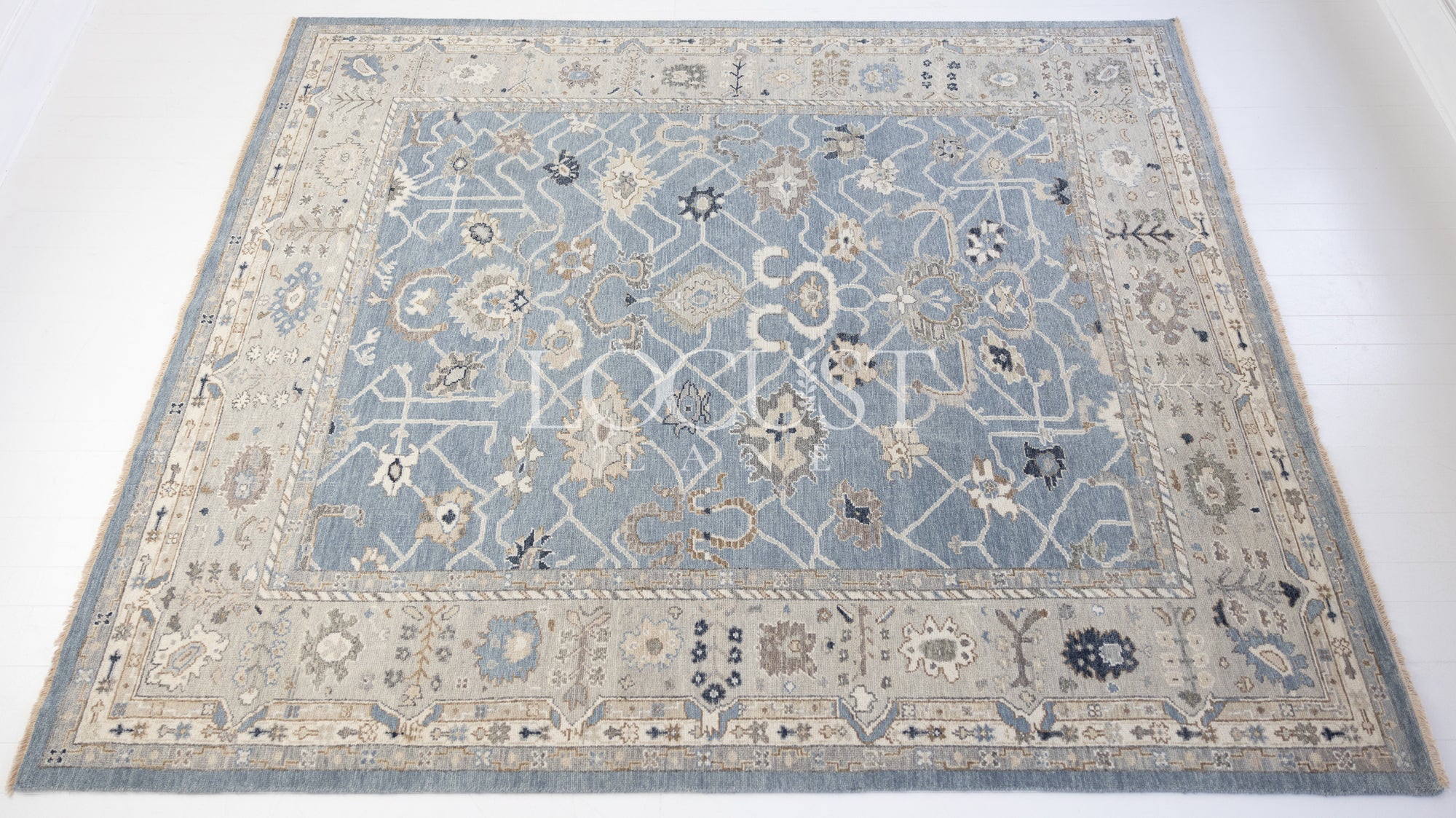 soft blue and neutral tone hand knotted rug