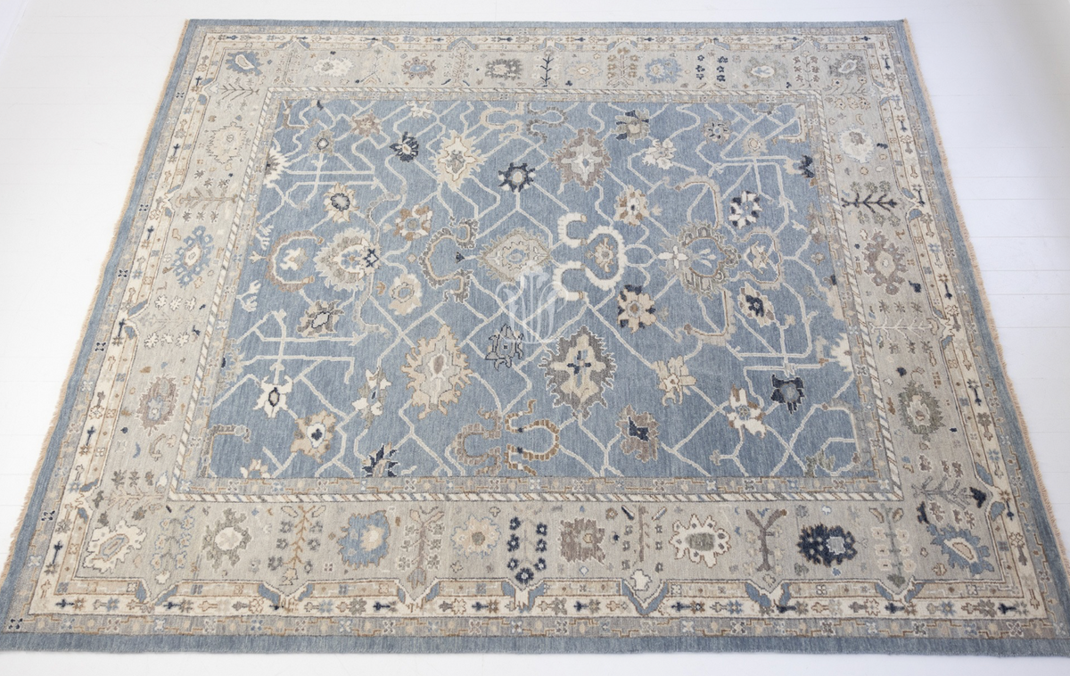 Trudie Modern Oushak area rug featuring a rich blue background and traditional Persian-inspired pattern