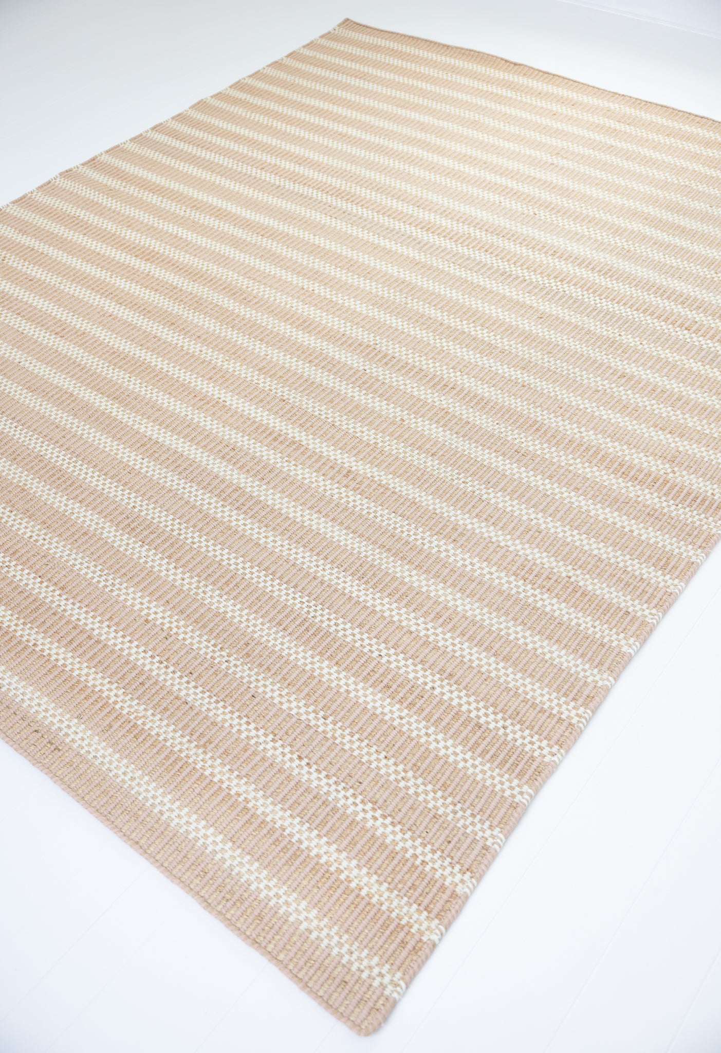 Handwoven jute and wool rug with blush pink, ivory, and natural stripes – Blush Jute & Wool Rug by Locust Lane Rugs